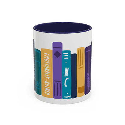 Ceramic mug from thtgrlreads featuring colorful vertical book spines with titles including "Emotionally-Ruined" and "NC" in a playful, graphic design on a white base with a dark blue interior.