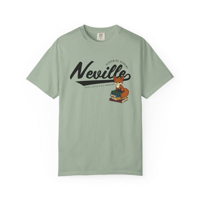 Thtgrlreads Bloodwing Academy collection comfort colors graphic tee featuring vintage wash sage green fabric and a playful fox illustration sitting on stacked books with stylized "Neville" text.