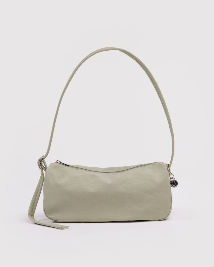 Celadon nylon loaf bag with curved top handle, side strap, and top zipper.