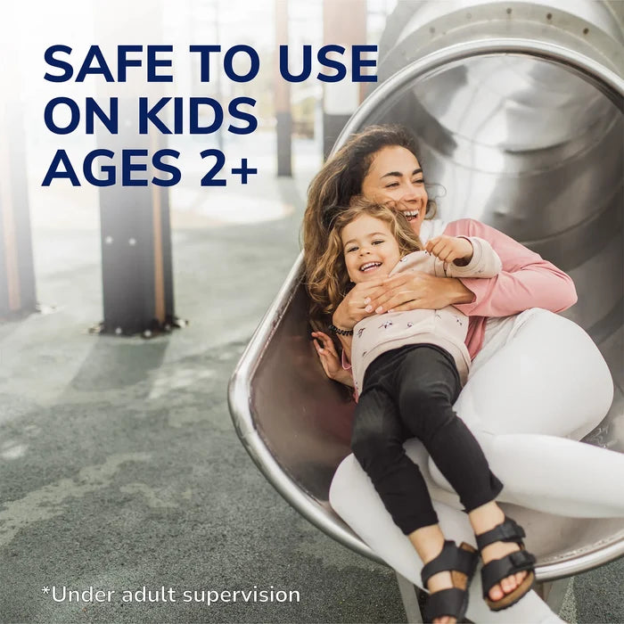 Family-friendly safety ad: smiling mother and child on a slide