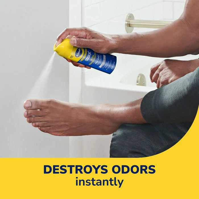 Odor-X Ultra powder spray can in hand dispensing near shower, yellow cap and blue can
