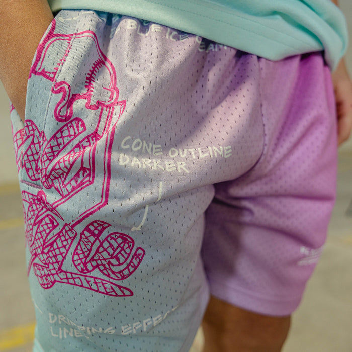 Close-up of a person wearing a sports outfit with pink graphics and text.