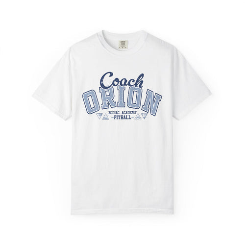 A white Comfort Colors graphic tee from thtgrlreads featuring a vintage puff print "Coach Orion" design with Zodiac Academy and Pitball text, part of the Zodiac Academy collection.