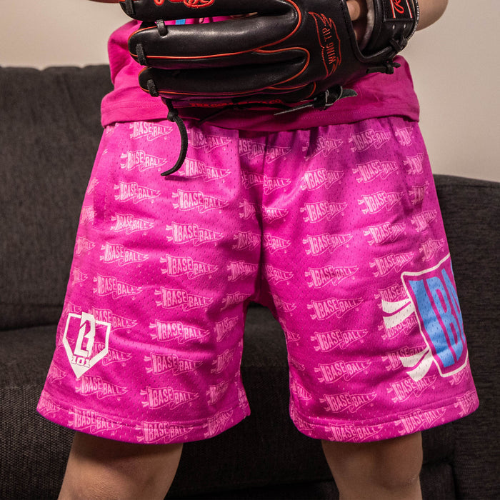 Youth model wearing pink Pennant Cotton Candy Pink youth shorts