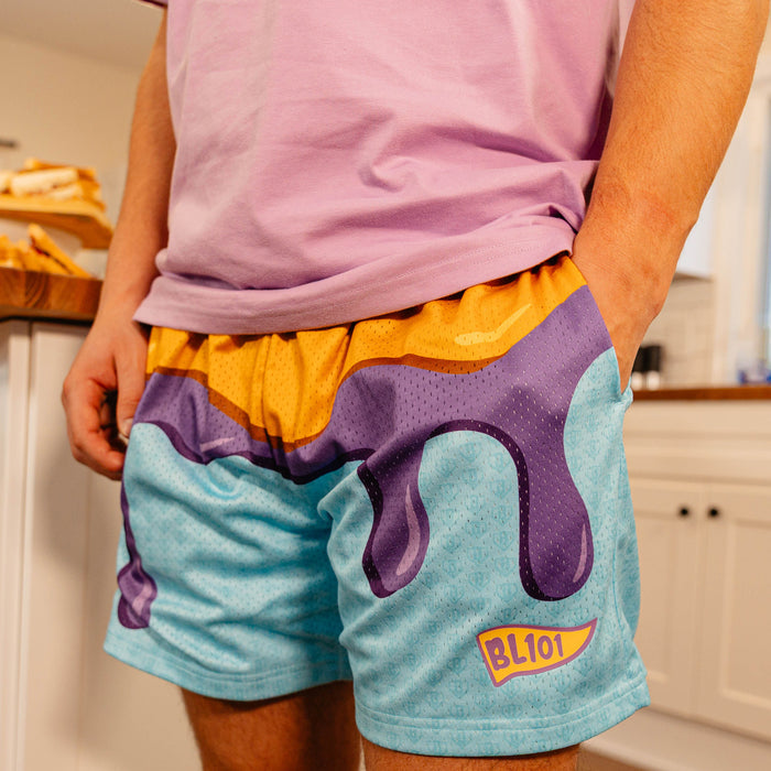 Close-up front view of BL101 PB&J mesh shorts on a male model, showing the dripping jelly graphic and BL101 logo.