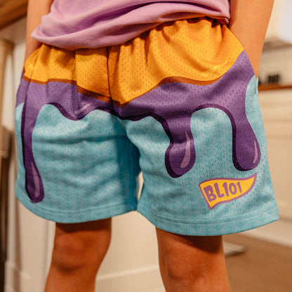 Close-up front view of BL101 youth PB&J mesh shorts showing the dripping jelly graphic and BL101 logo.