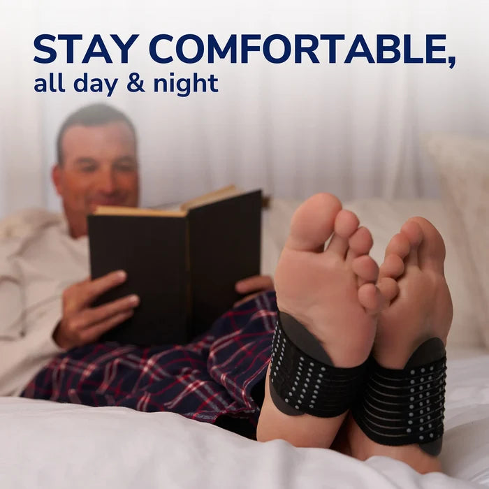 Black arch support sleeve on bare foot for overnight cushioning arch support