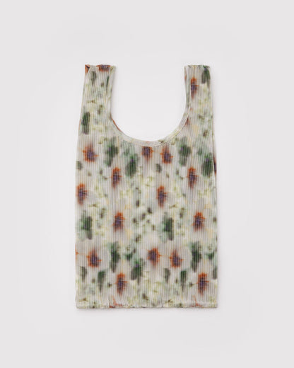 Pleated Baggu tote with light cream watercolor floral print and wide U-shaped opening