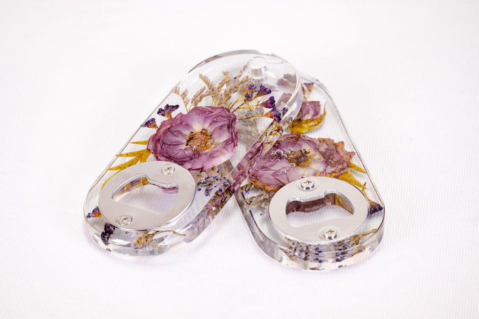Landscape photo of a pressed flower large bookend set with blush dried roses on a countertop