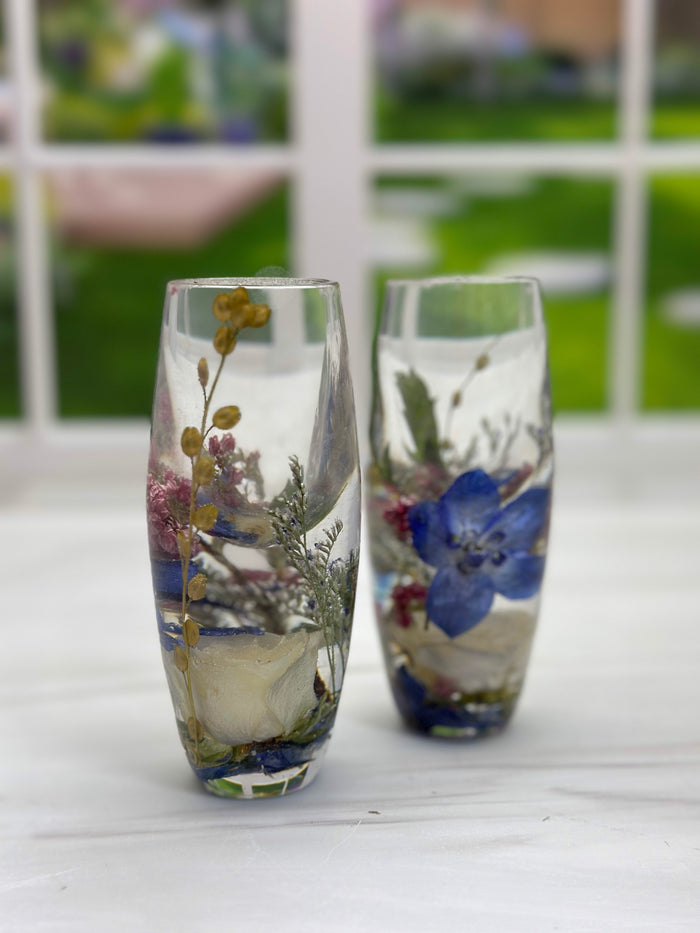 Tall portrait photo of a pressed flower resin preservation display with blush dried roses