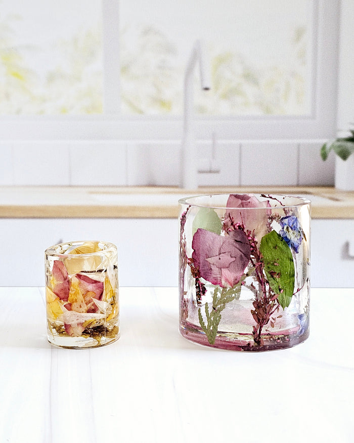 Tall portrait photo of a pressed flower large ring holder with colourful tropical dried flowers