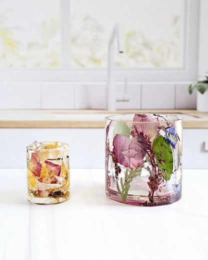Tall portrait photo of a pressed flower large ring holder with colourful tropical dried flowers