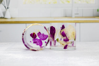 Landscape photo of a pressed flower whiskey cup with mixed dried blooms in clear resin