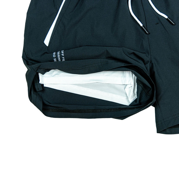 Adult model wearing black and white Pro Series with Liner shorts