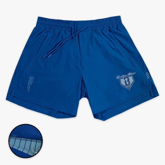 Blue shorts with a small BL101 Jackson Olson logo on a white background