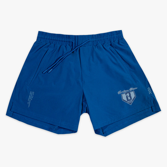 Blue shorts with a small BL101 Jackson Olson logo on a white background