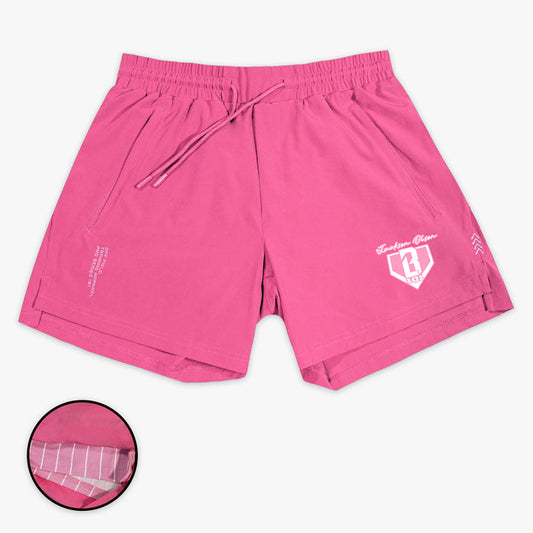 Pink shorts with a Jackson Olson BL101 logo on a white background
