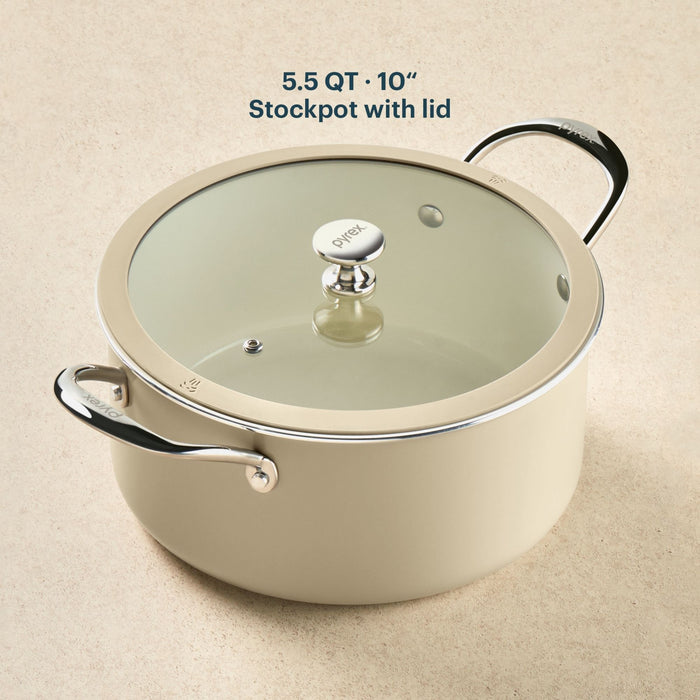 Beige stockpot with lid on a beige background