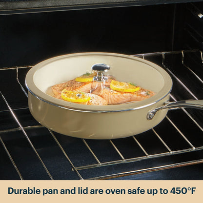 Ceramic cookware with lid containing salmon dish inside an oven.