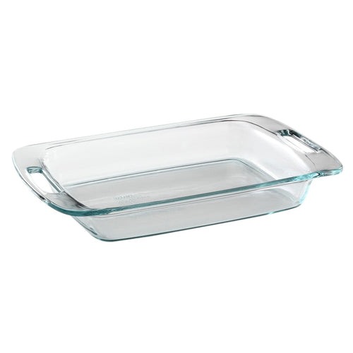 Clear glass baking dish with handles on a white background