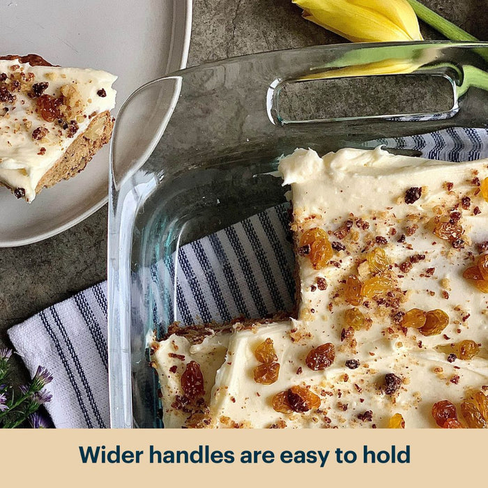 Glass baking dish with dessert, slice on plate, and text 'Wider handles are easy to hold'.