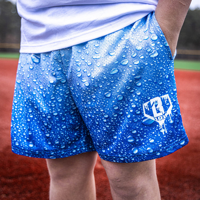 Adult model wearing blue Rain Delay Droplet shorts