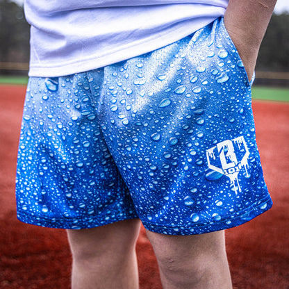 Adult model wearing blue Rain Delay Droplet shorts