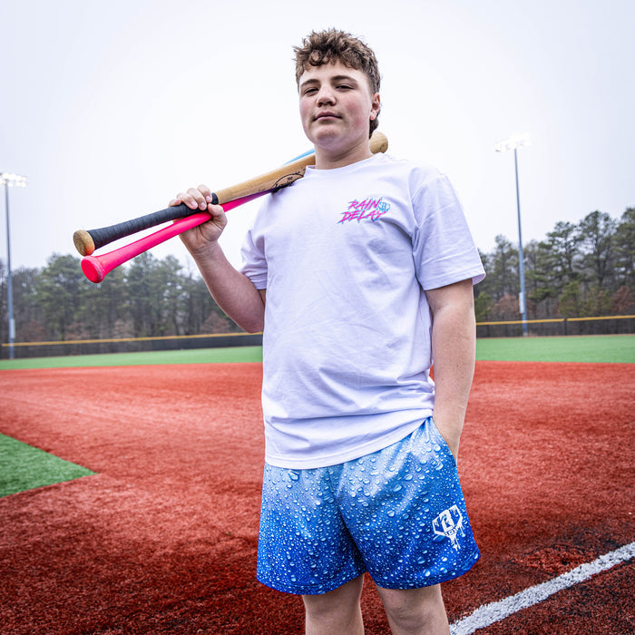 Adult model wearing blue Rain Delay Droplet shorts