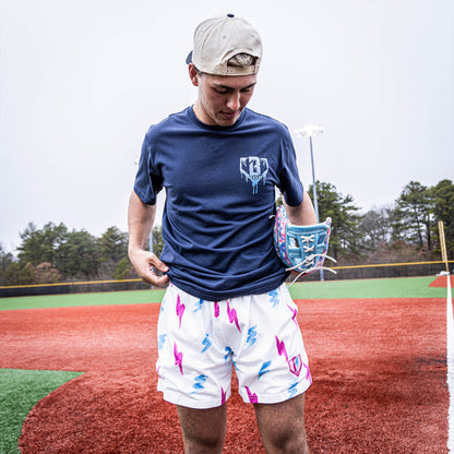 Adult model wearing white Rain Delay Lightning Bolt shorts