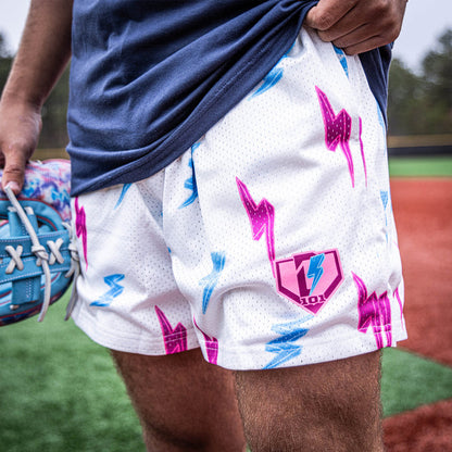 Youth model wearing white Rain Delay Lightning Bolt youth shorts
