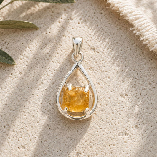 Raw Citrine Silver Teardrop Pendant with natural rough citrine crystal in an open sterling silver setting.
