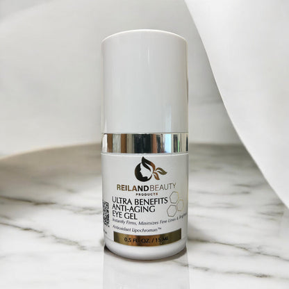 Reiland Ultra Benefit Anti-Aging Eye Gel placed on a luxurious marble surface with soft white draping, emphasizing elegance and clinical quality.
