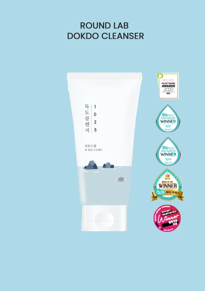 Round Lab Dokdo Cleanser tube on a light blue background with certification logos.
