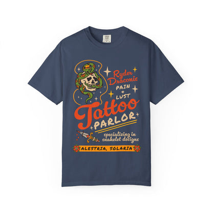 Thtgrlreads navy Comfort Colors graphic tee from the Ruthless Boys of the Zodiac collection featuring a vintage tattoo parlor design with a skull and snake, inspired by zodiac fantasy themes.