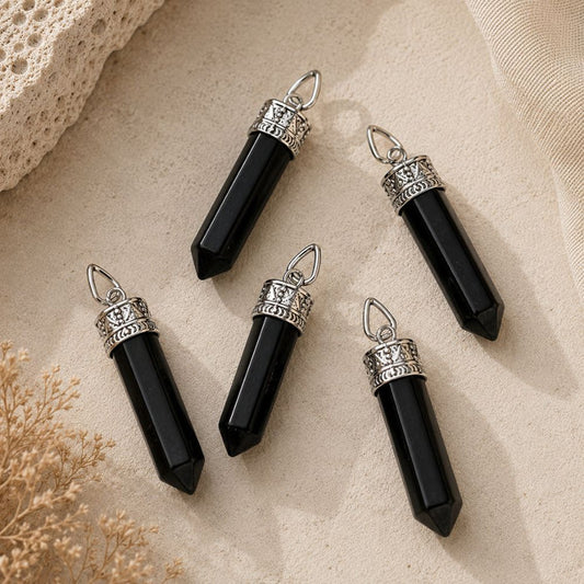 Shungite point pendant with silver cap and bail on matching chain.