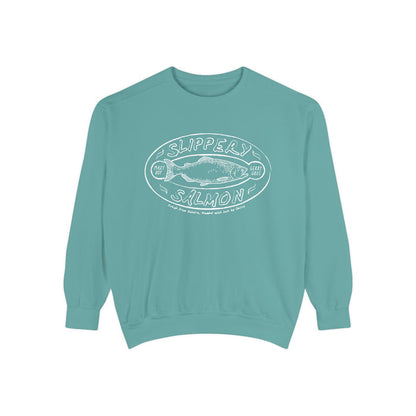 Zodiac Academy crewneck sweatshirt by thtgrlreads featuring a vintage-wash turquoise Comfort Colors base with a white graphic print of a slippery salmon and playful text, perfect for bookish merch fans.