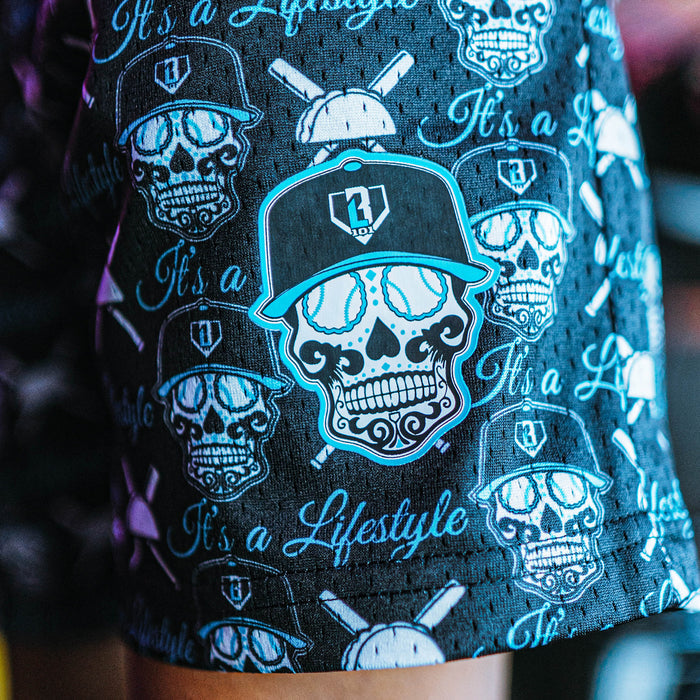 Black shorts with Black, white and Blue skull and cap design and 'It's a Lifestyle' text on a dark background