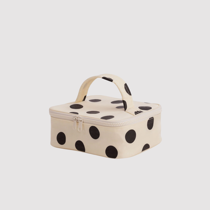 Small cosmetic case, cream with large black polka dots, zip top and handle