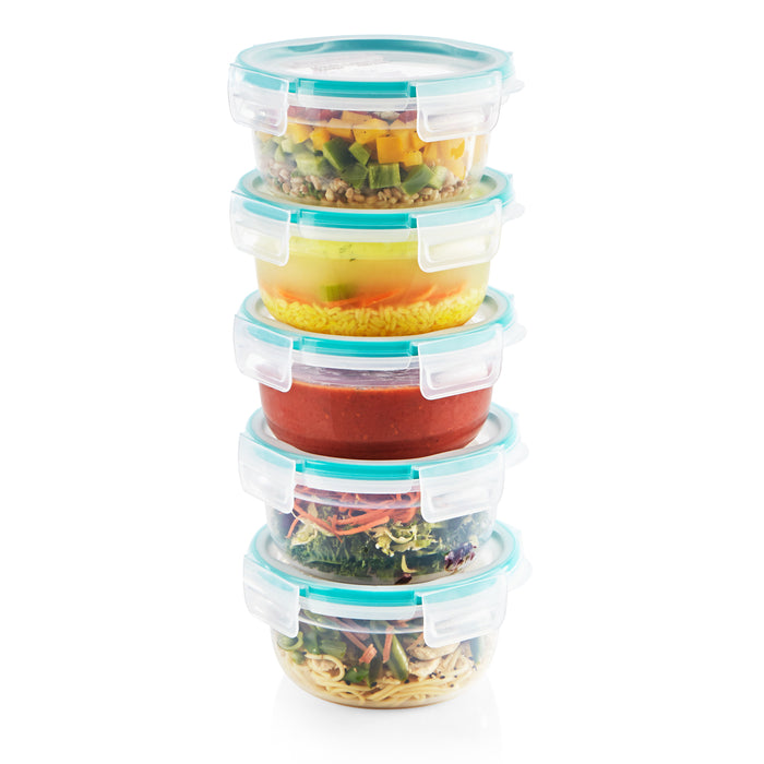 Stack of food storage containers with various meals inside on a white background