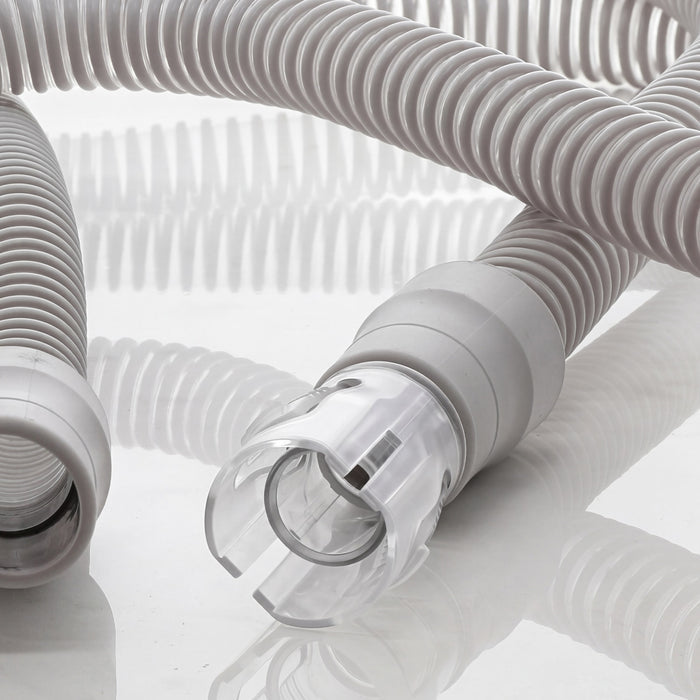 Close-up of a medical device hose on a reflective surface