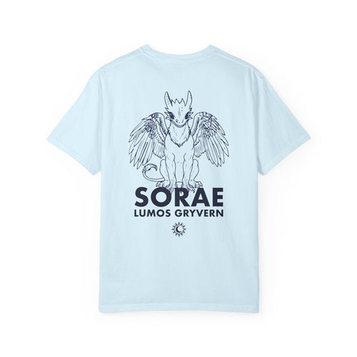The thtgrlreads Kindred's Curse Saga Comfort Colors graphic tee features a light blue 100% ring-spun cotton base with a black line art print of a winged gryvern and bold text, officially licensed by Penn Cole and available through Printify in the Tees collection.