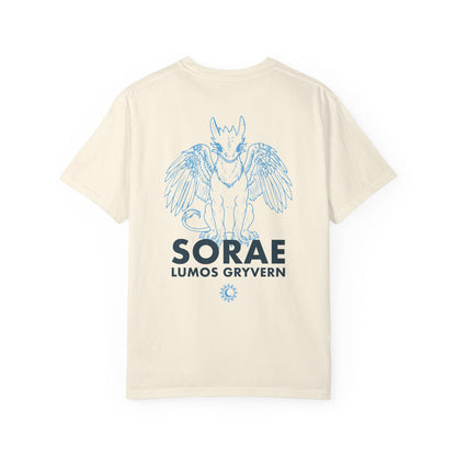 Cream Comfort Colors graphic tee from thtgrlreads featuring a blue line art gryvern illustration and bold text inspired by Kindred’s Curse Saga by Penn Cole, available via Printify in the Tees collection.
