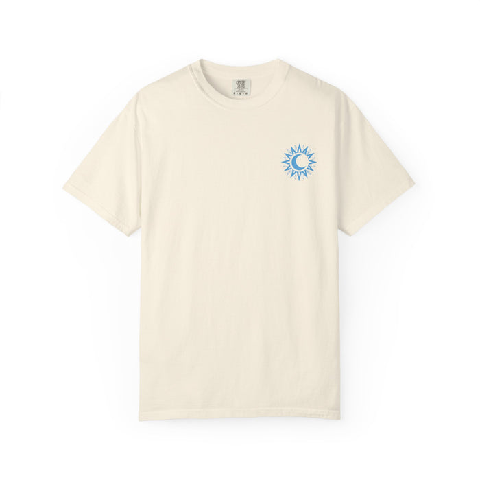 thtgrlreads officially licensed Kindred's Curse Saga Comfort Colors graphic tee in vintage cream, featuring a small blue sun and crescent moon emblem on the chest, printed by Printify.