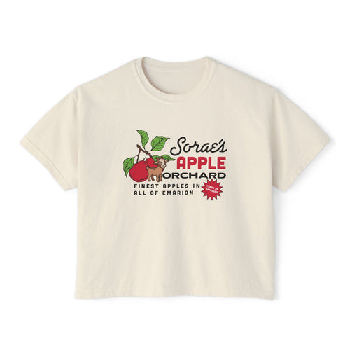 thtgrlreads Kindred's Curse Saga cream-colored Comfort Colors crop top featuring a vintage-style graphic of red apples and green leaves with bold text promoting Sorae’s Apple Orchard.