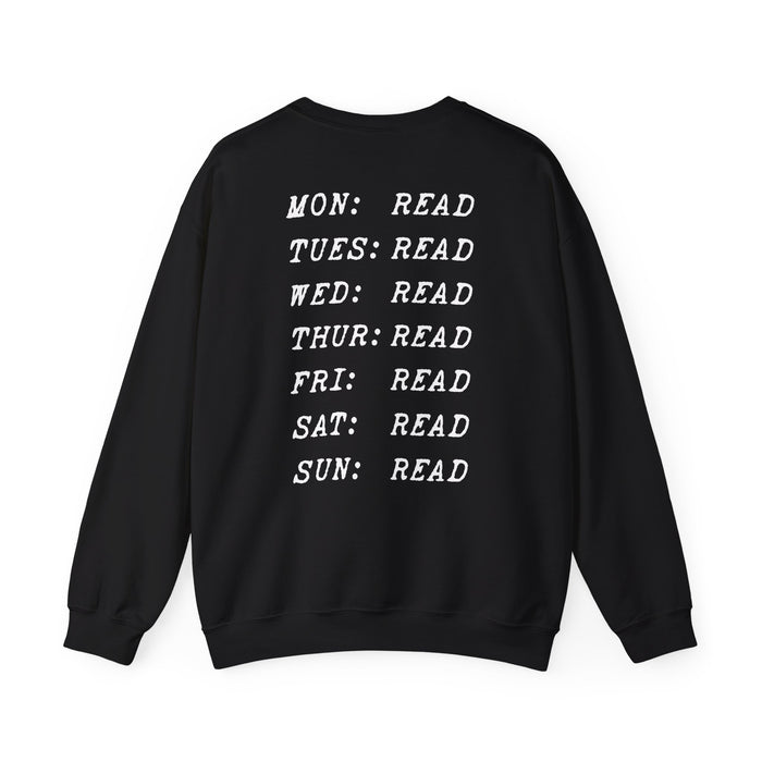 Thtgrlreads book bestie collection oversized crewneck sweatshirt in vintage black with white text listing each day of the week paired with "READ" in a bold typewriter font, cozy unisex fit from comfort colors.