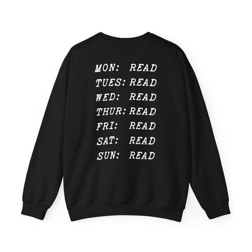 Thtgrlreads book bestie collection oversized crewneck sweatshirt in vintage black with white text listing each day of the week paired with "READ" in a bold typewriter font, cozy unisex fit from comfort colors.