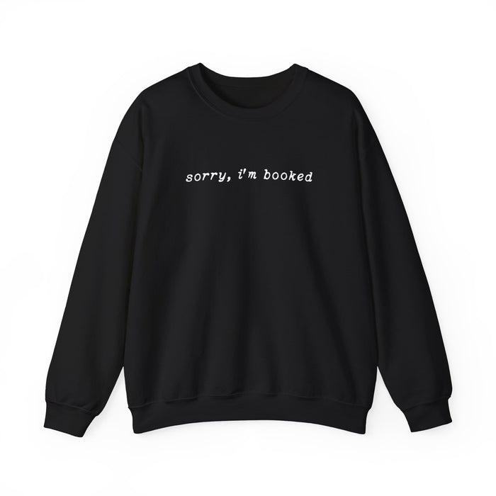 thtgrlreads black oversized crewneck sweatshirt with vintage white typewriter font text reading "sorry, i'm booked" in a cozy, relaxed fit design