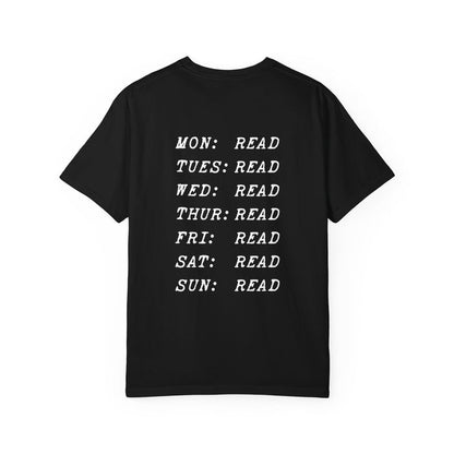 Black Comfort Colors graphic tee by thtgrlreads from the Book Bestie collection featuring white vintage puff print text listing every day of the week with "READ" next to each day.