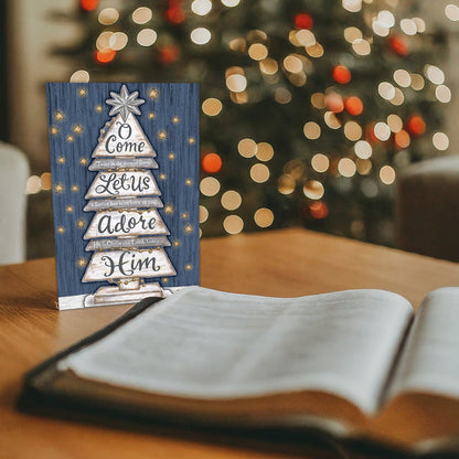 Christmas card on table next to bible