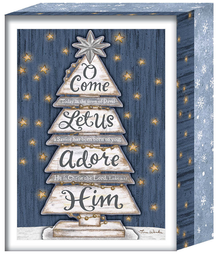 Decorative Christmas box with star design and text on a blue wooden background